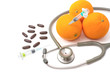 Pill,stethoscope,syringe with orange fruit ,Vitamin C supplement