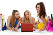 Photo: Three young women with laptop. Shopping. Three young women with laptop. Shopping.