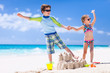 Foto: Two kids playing at beach Two kids playing at beach
