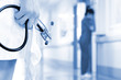 Foto: Doctor with surgical mask and a stethoscope in a hospital Doctor with surgical mask and a stethoscope in a hospital