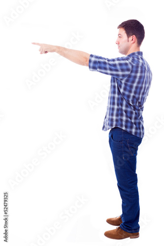 Photo: young casual man pointing towards copyspace, isolated on white b young casual man pointing towards copyspace, isolated on white b