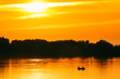 Fisherman on a Boat at Sunset