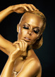 Photo: Glint. Coloring. Woman with Golden Faceart. Creative Concept Glint. Coloring. Woman with Golden Faceart. Creative Concept