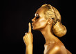 Secrecy. Bodyart. Golden Woman showing Silence Sign. Hush!