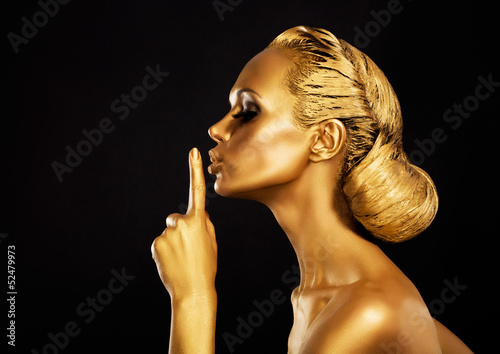 Photo: Secrecy. Bodyart. Golden Woman showing Silence Sign. Hush! Secrecy. Bodyart. Golden Woman showing Silence Sign. Hush!