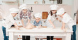 happy little chefs preparing dough in the kitchen with their