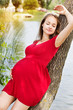 Photo: Young attractive pregnant woman enjoying near lake Young attractive pregnant woman enjoying near lake