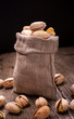 Bag of pistachios on dark