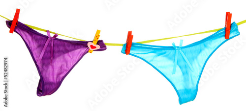 Photo: Women's panties hanging on rope isolated on white Women's panties hanging on rope isolated on white
