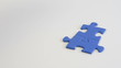 building a jigsaw of blue pieces - by Hand