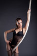 Portrait of sexy woman posing with rope