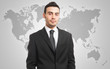 Businessman in front of a world map