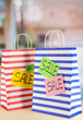 Photo: Striped bags on bright background Striped bags on bright background