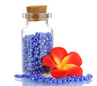 Little bottle full with colorful beads isolated on white