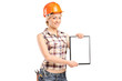 Photo: Female worker showing a blank clipboard Female worker showing a blank clipboard