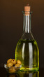 Original glass bottle with oil on dark color background