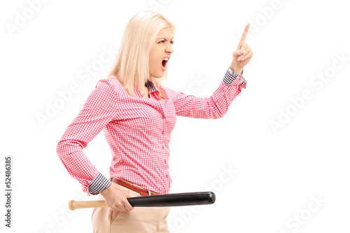 Photo: Violent young woman holding a baseball bat and threatening Violent young woman holding a baseball bat and threatening