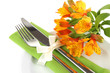 Festive dining table setting with flowers isolated on white