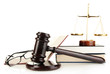 Golden scales of justice, gavel and books isolated on white