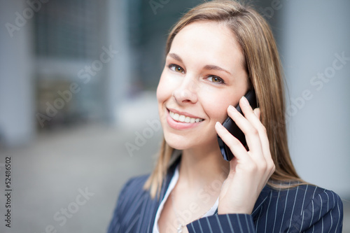 Photo: Businesswoman talking on the phone Businesswoman talking on the phone