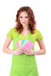 Young woman wearing green apron with cleaning sponges, isolated