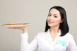 Beautiful girl waiter with pizza isolated on white
