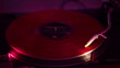 Turntable spinning vinyl record in nightclub. 