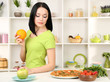 Pretty girl selects pizza or diet on kitchen background