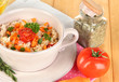 Delicious rice with vegetables and herbs in pot