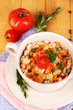 Delicious rice with vegetables and herbs in pot