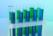Identical test tubes on blue background