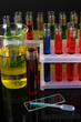 Colorful test tubes on bright background