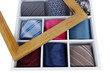 Neckties in wooden box isolated on white