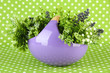Pot With Flowers On A Green Fa...