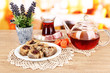 Sweet baklava on plate with tea on table in room