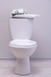 Money and gun on toilet tank in a bathroom