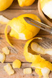 Peeling lemons on wooden table
