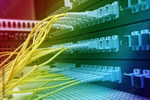 Photo: fiber cable serve with technology style against fiber optic back fiber cable serve with technology style against fiber optic back