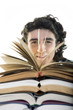 Photo: Student looking back the book stacks Student looking back the book stacks