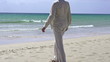 Happy, excited man relaxing on beach, super slow motion