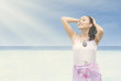 Beautiful girl enjoy sunshine at beach