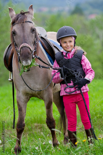 Photo: Horse and lovely equestrian girl. Horse and lovely equestrian girl.