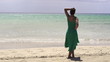 Woman in dress relaxing on the beach, super slow motion