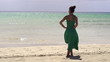 Woman in dress relaxing on the beach, super slow motion