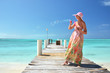 Photo: Girl on the wooden jetty making soap bubbles. Exuma, Bahamas Girl on the wooden jetty making soap bubbles. Exuma, Bahamas