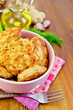 Fritters chicken in a pink bowl on a napkin