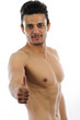Muscular Man pointing OK isolated white background