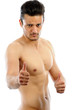 Muscular Man pointing OK isolated white background