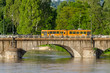 Turin, old orange tram on a bridge