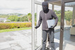 Burglar holding laptop